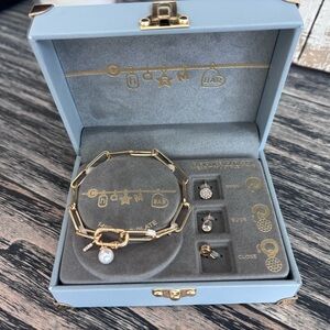 Elegant Gold and Silver Charm Bracelet